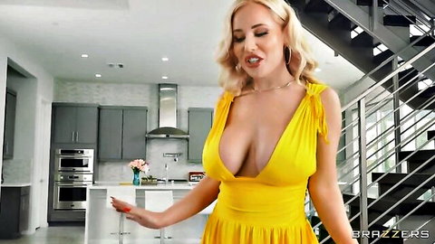 Savannah Bond in sexy yellow dress, blonde with deep cleavage tease