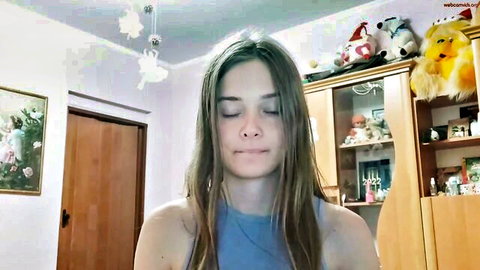 Sweet_kiira petite German camgirl in blue tank top, eyes closed seductively