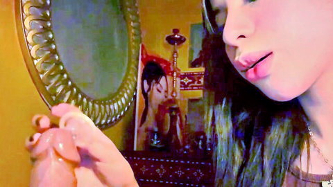 Arab beauty with plump glossy lips teasing pink dildo in hookah lounge mirror room
