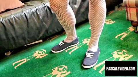 Kiera King legs in fishnet stockings and sneakers kinky pose