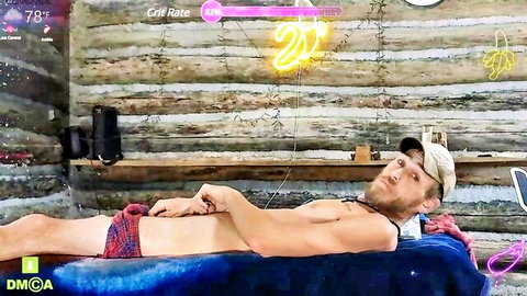 Allan Arod shirtless in plaid underwear, lounging seductively on Chaturbate