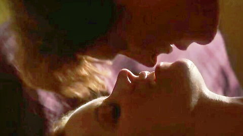 Bearded man passionately french kissing nude blonde woman's lips in vintage foreplay closeup
