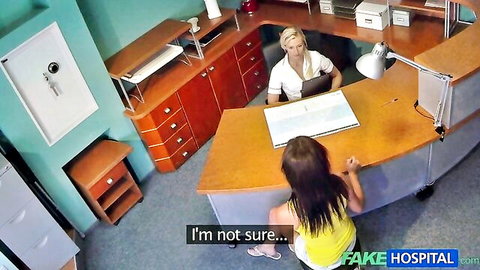 Blonde nurse seduces unsure brunette patient in hospital office