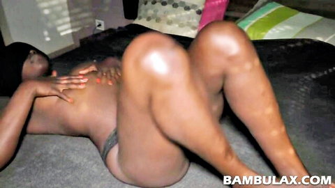 EboBlack ebony beauty lying nude, big ass in thong, teasing curves