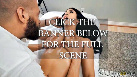 Black masseur oils up busty Asian beauty in sensual massage scene