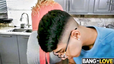 Hot blonde MILF bent over sink getting oral from young guy in kitchen