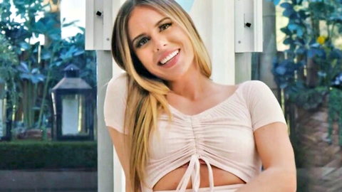 Blonde beauty in pink tied crop top smiling for steamy Japanese massage