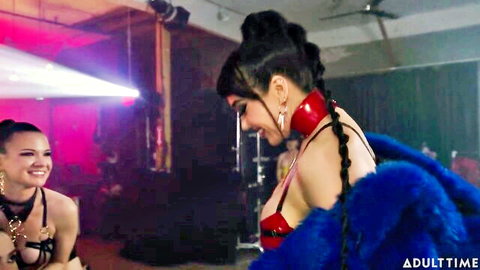Casey Calvert and Sophia Locke in intimate lesbian moment, red latex and fur