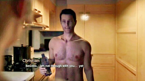 Shirtless muscular Christian in kitchen, teasing 'not through with you yet'