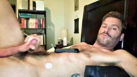 Muscular bearded guy gets handjob from hot chick in webcam show