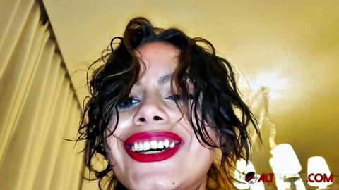 Genevieve Sinn with wet curly hair and red lips smiling in AltErotic thumbnail