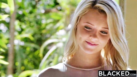 Smiling blonde in sheer top outdoors for Blacked interracial scene