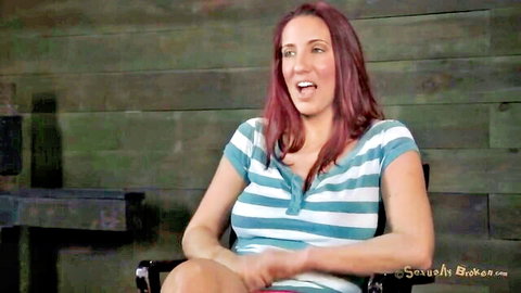 Kelly Divine redhead in striped tank top, expressive pose