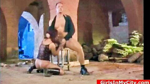 Bia kneels submissively in BDSM oral session with exposed partner