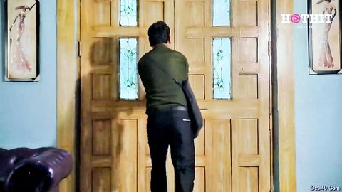 Indian man in green shirt approaching door in Sexy Dhoban episode 1