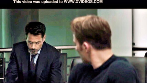 Tony Stark lookalike in suit faces Captain America in black shirt in Marvel parody office scene