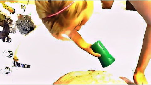 Curvy animated blonde MILF with big tits holds green dildo in handjob grip.