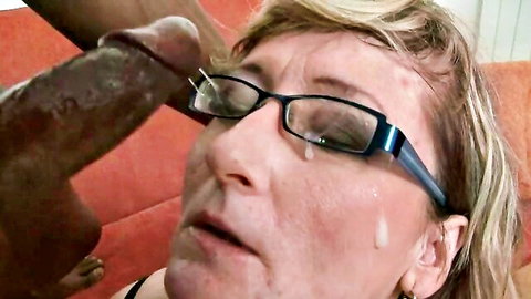 Mature Tia Gunn takes facial cumshot on glasses and face