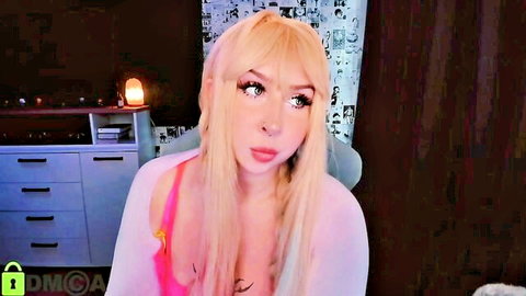Blonde webcam babe teasing in sheer pink top exposing perky tits and hard nipples