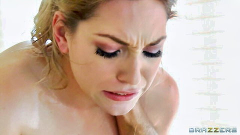 Lily Labeau topless wet blonde with intense expression in oil massage