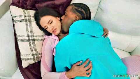 Angela White cuddling and kissing muscular black man intimately