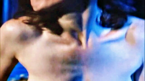 Vintage brunette mature with medium natural tits exposed, open mouth in sensual blowjob pose