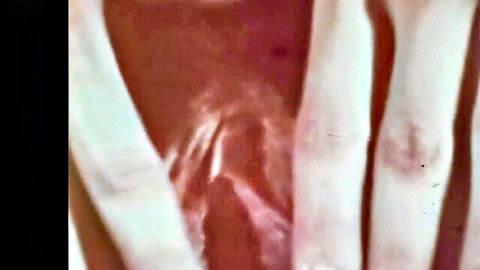 Close-up of hairy pussy spread wide by fingers exposing wet pink vagina