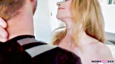 Blonde MILF in intimate neck kiss with man in hot anal sex preview