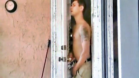 Tattooed shirtless man in doorway for Rachel Porn's mature granny blowjob