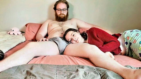 Amateur couple cuddles intimately on bed, bearded man in underwear with teen girl in pajamas