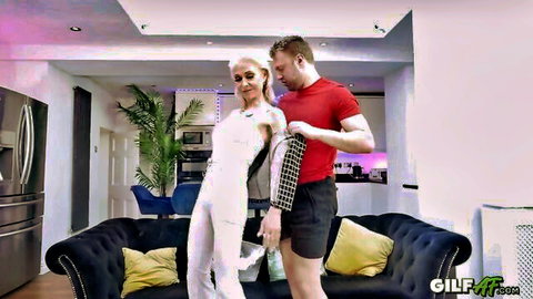 Sexy blonde granny in white outfit teased by muscular guy
