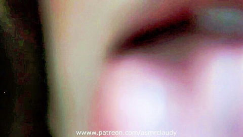 Seductive close-up of glossy pink wet lips parted for ASMR cock tease