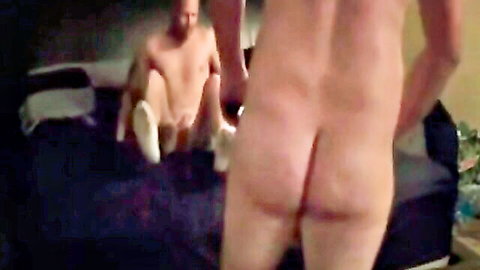 Naked muscular man bends over bed exposing bare hairy ass crack and balls in white socks