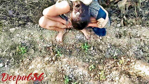 Indian housewife squats low outdoors in disheveled saree teasing pussy in field