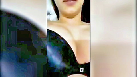 Busty Asian babe with huge tits spilling from tight black bra cleavage tease