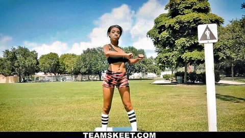 Fit young black babe in sports bra and shorts posing outdoors before BBC cuckold action
