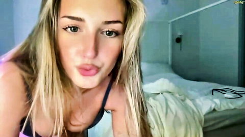 Blonde beauty Avery Rae Miller pouting in sexy black top webcam tease