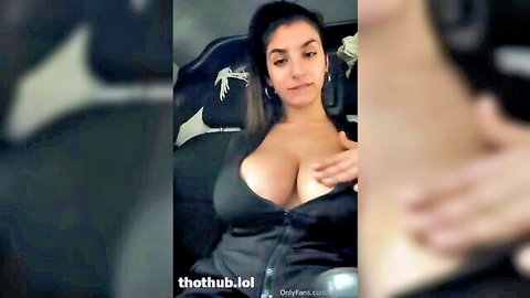 Bufalika teases huge tits in unzipped black top during public car boob play