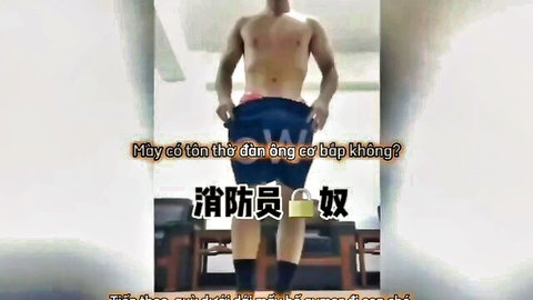 Shirtless muscular Asian twink pulls down pants exposing erect cock
