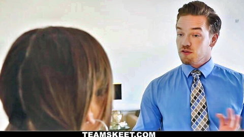 Freckled guy in blue shirt and tie talks to sexy brunette babe from behind