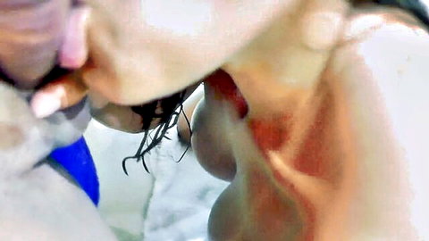 Tanned Latina with big tits kissing and sucking massive cock tip in steamy shower
