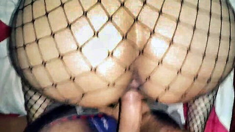 Woman in fishnet stockings fucked doggy style from behind