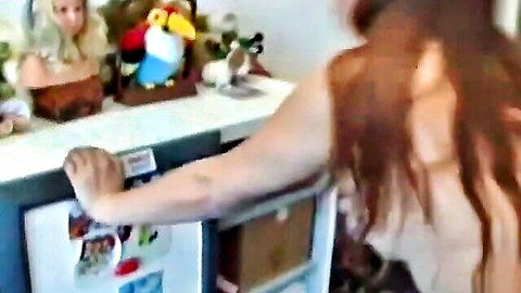 Redhead Russian MILF reaching in casual home setting, mature mom vibe