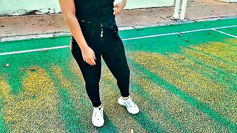 Latina woman in tight black outfit posing outdoors for paid sex encounter
