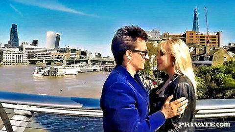 Curvy blonde Karlie Simon embraces lover on London bridge overlook