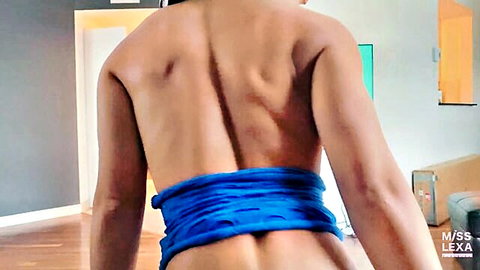 Nude slim woman bound with blue rope around hips from behind teasing bare ass cheeks