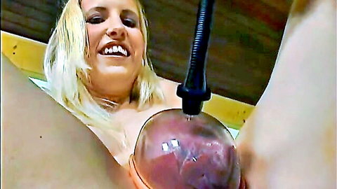 Smiling blonde babe pumps her swollen pussy lips with vacuum cup toy