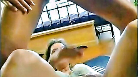 Brunette peeing in POV closeup, legs spread exposing shaved pussy and tits
