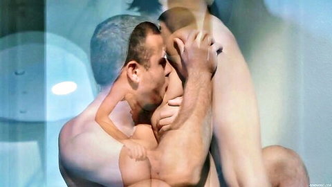 Two muscular men embracing and kissing passionately nude