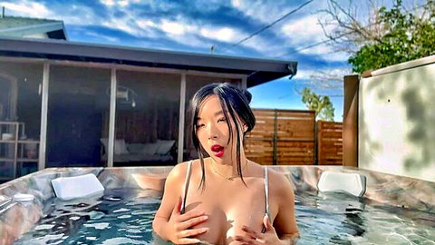 Elle Lee Korean beauty teasing big tits in hot tub bikini